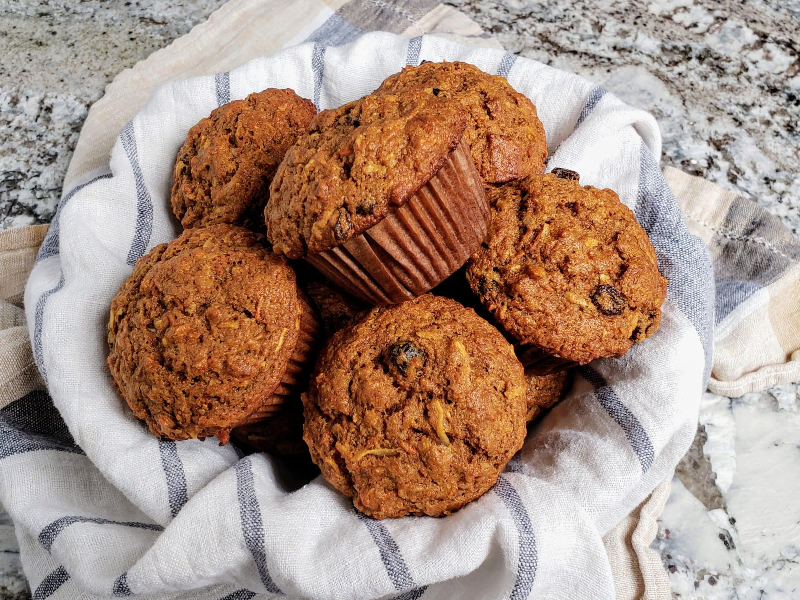 morning glory muffins on a white and gray striped towel